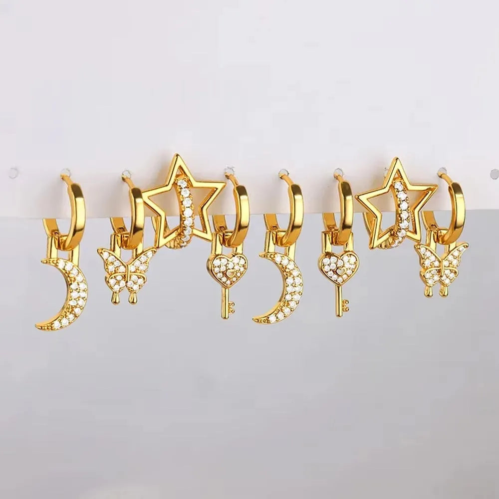 Women's irregular geometric butterfly earrings in copper with heart, bow and star motifs