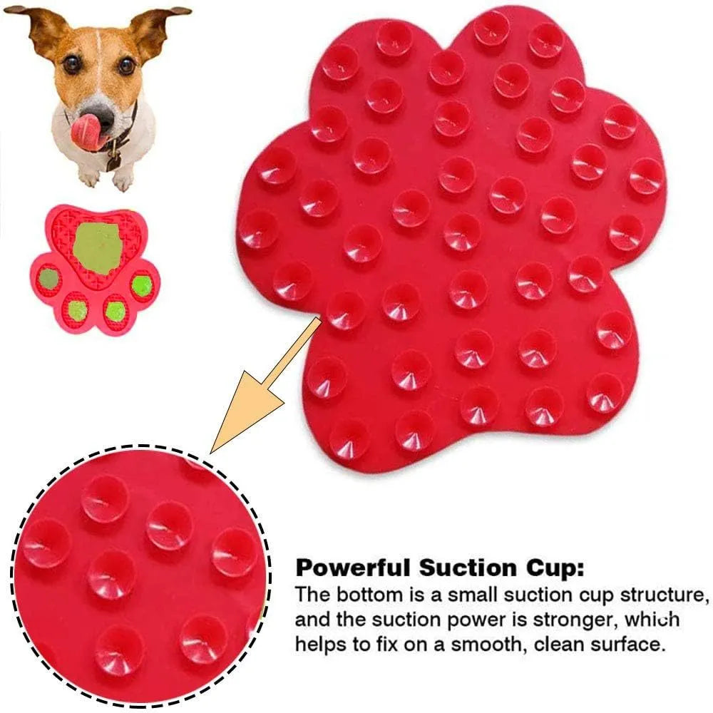 Blue silicone dog licking mat with bone texture and suction cups on a tiled wall