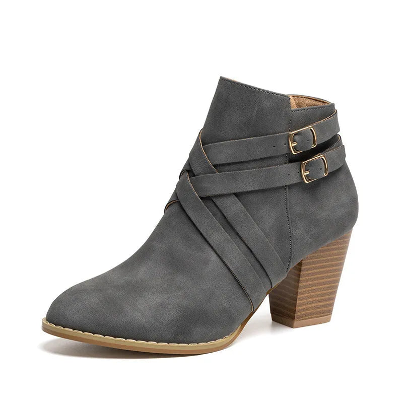 Women's grey PU leather short ankle boot with side zip, buckle strap, and a thick 7cm rubber heel.