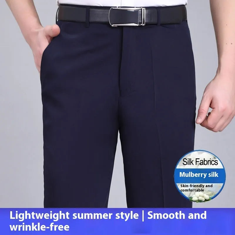 Man wearing dark blue non-iron straight-fit mulberry silk blend business trousers.