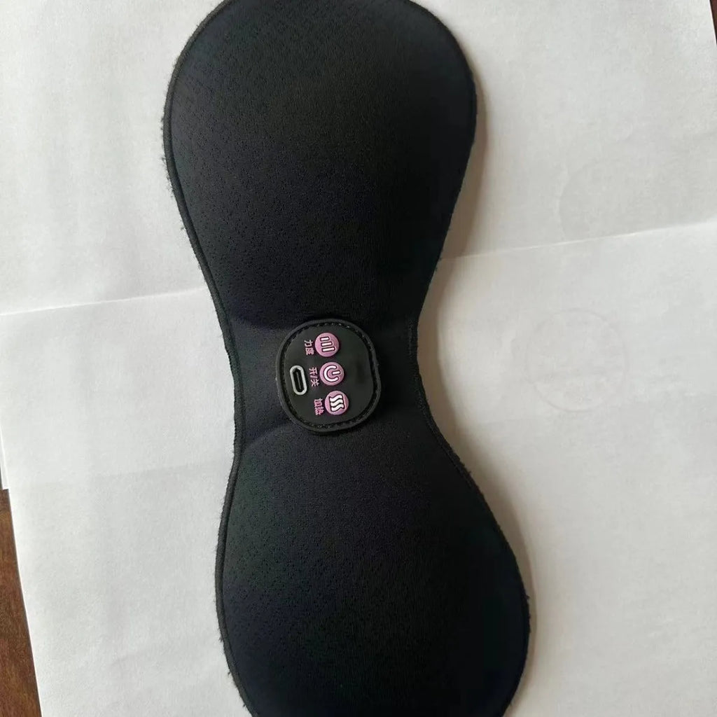 Black electric massage bra inner cushion with adhesive chest stickers and a 3-key control panel.