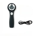 Black and silver handheld appraisal magnifying glass with optical glass lens and USB-C cable on a table.