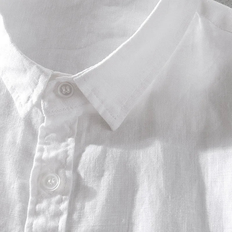 Man wearing a loose fit apricot coloured short sleeve linen cotton blend shirt.