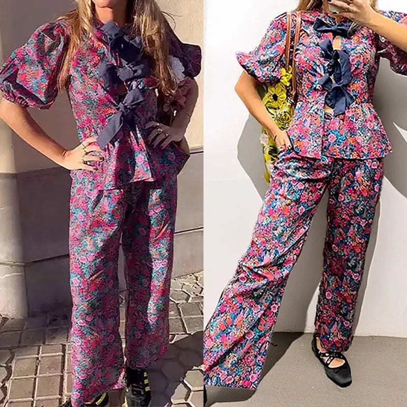 Women's floral print trouser suit with puff sleeve blouse and matching trousers