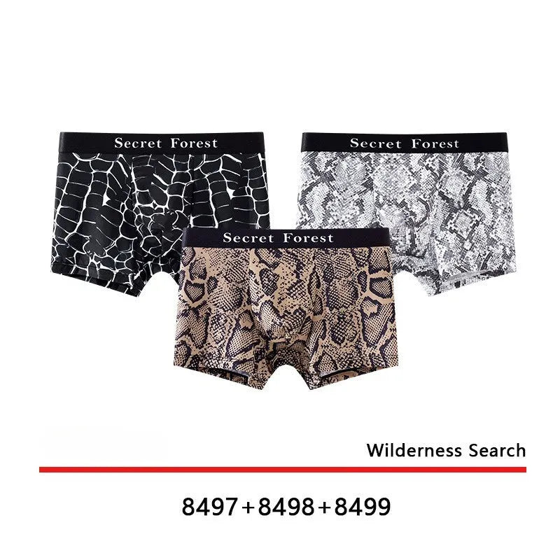 Men's thin loose polyester boxer shorts in black on grey background showing mid-waist design