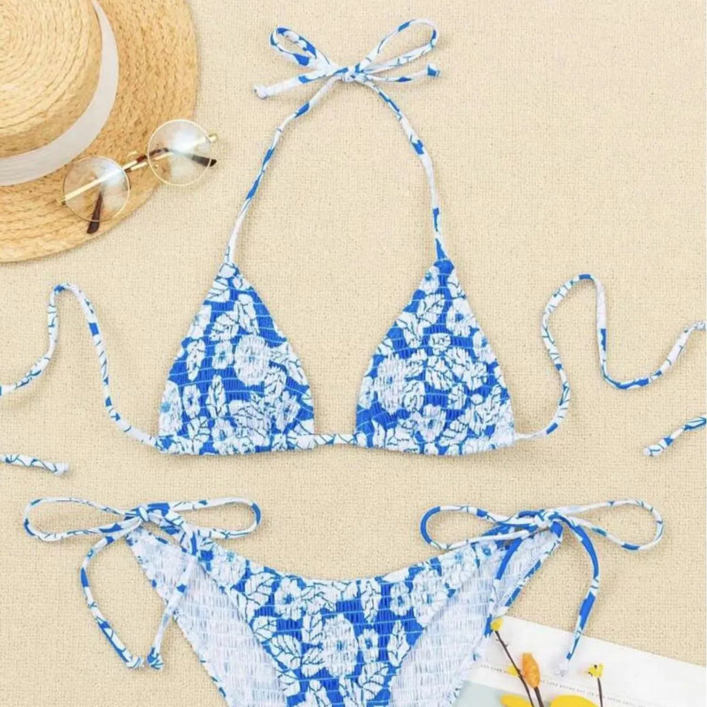 Women's floral halter neck two-piece swimsuit in briefs style, shown in light blue colour.