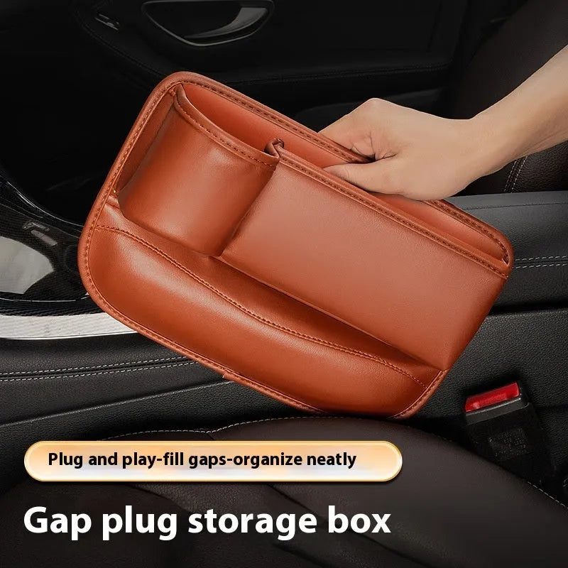 Car seat gap storage box in black leather with built-in water cup holder, fitted between driver seat and centre console