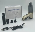 Wireless handheld car and pet vacuum cleaner in gold colour with USB charging cable