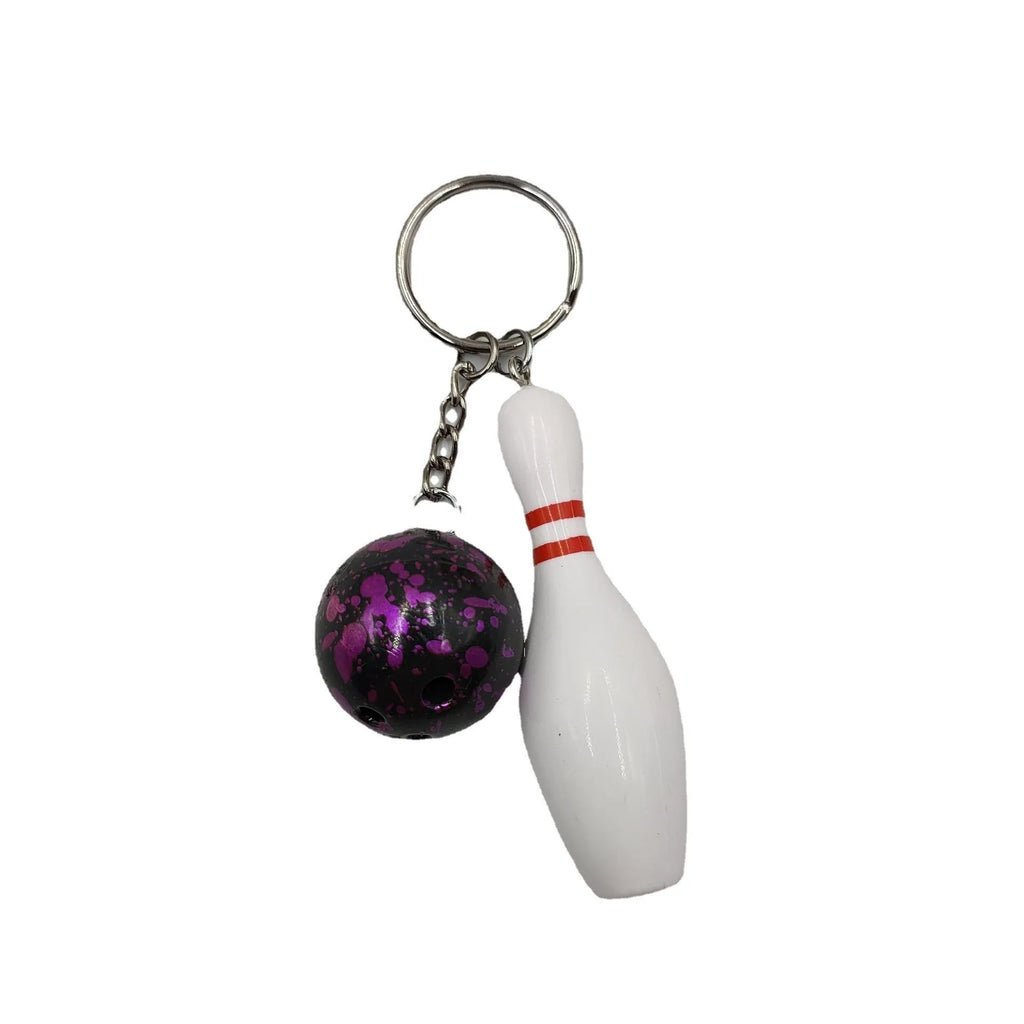 Mini bowling ball keychain pendant in PVC metal available in four colours: dark red, blue, purple, green