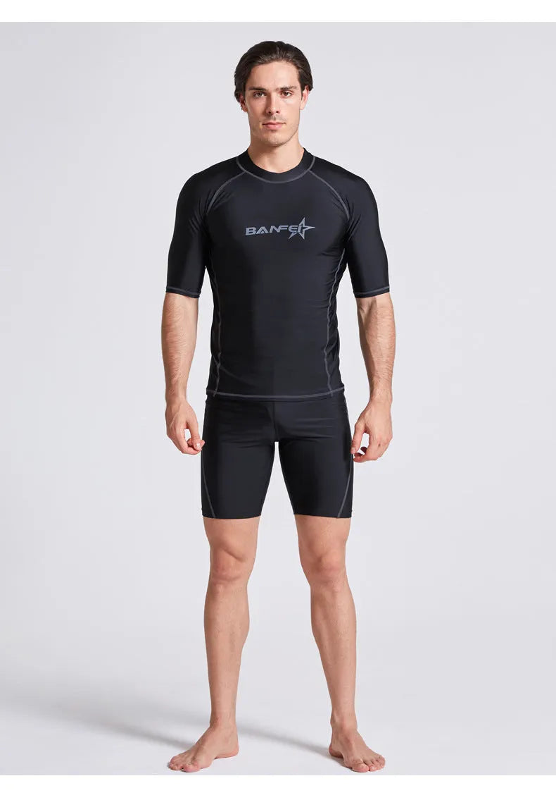 Men's half-sleeve nylon swimsuit set in blue for snorkelling and surfing with matching top and pants