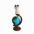 Cartoon cat resin figurine with Statue of Liberty travel theme on display