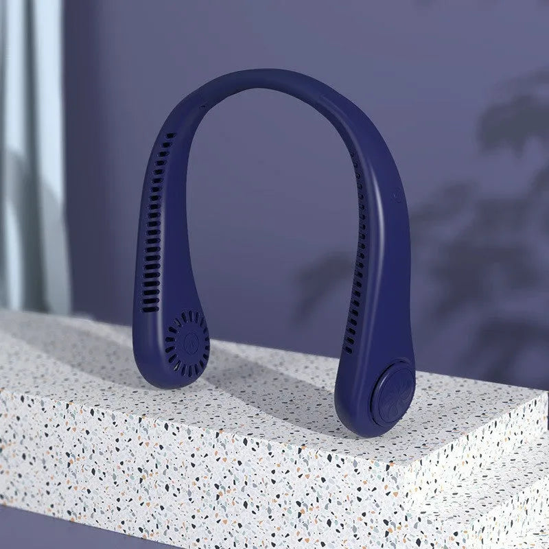 Pink bladeless neck fan hanging around neck with USB charging cable