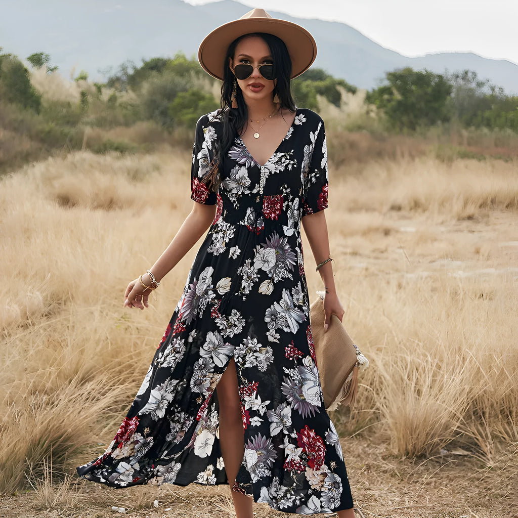 Women's yellow floral print summer dress with V neck and elastic waist on a mannequin.
