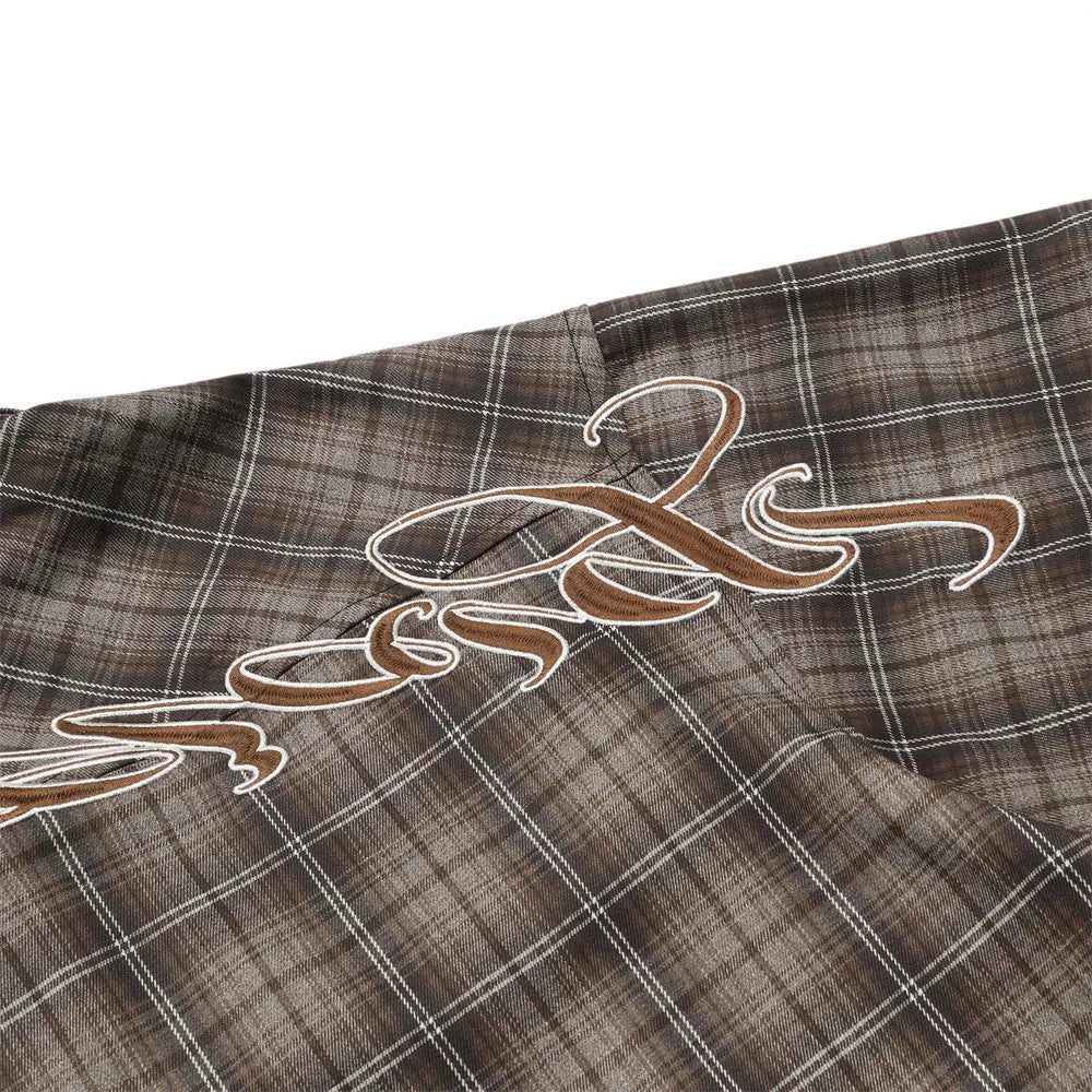 Men's black and brown plaid short sleeve shirt with embroidered lettering and lapel collar