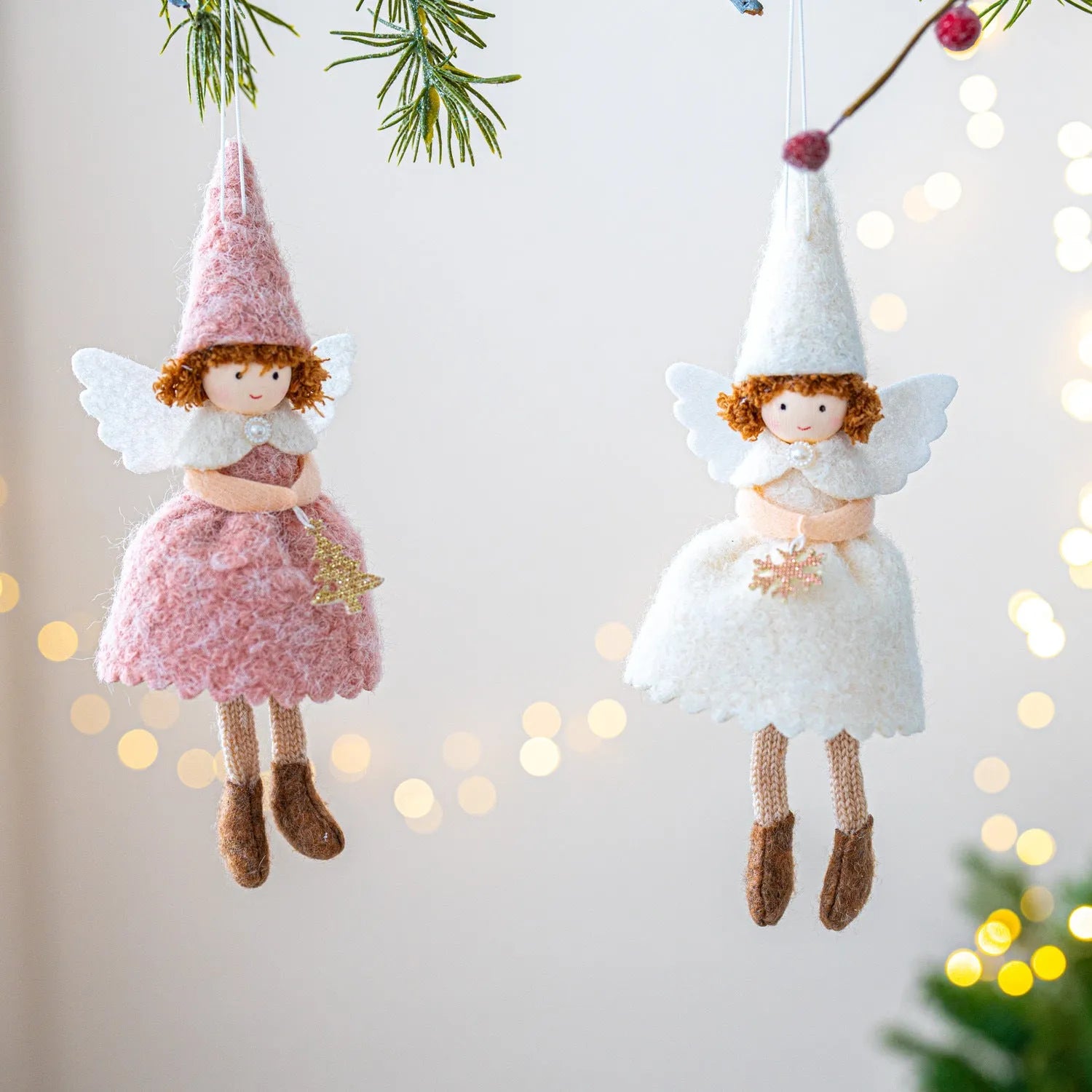 Close-up of a white cloth angel skirt felt pendant Christmas tree ornament.