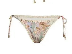 Women's floral pattern bikini set with top, briefs, and skirt in creamy-white colour