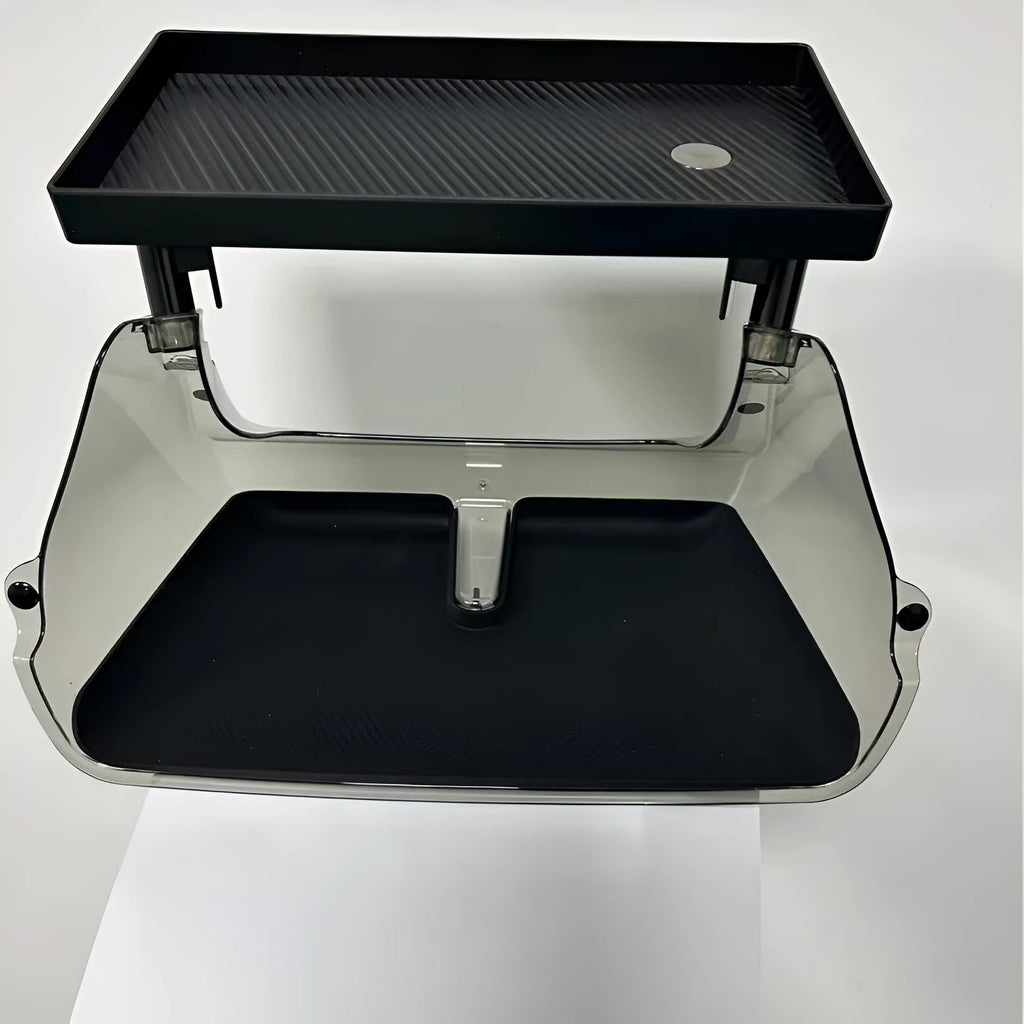 Black ABS storage box for Tesla Model 3 and Y, positioned under the centre touchscreen.