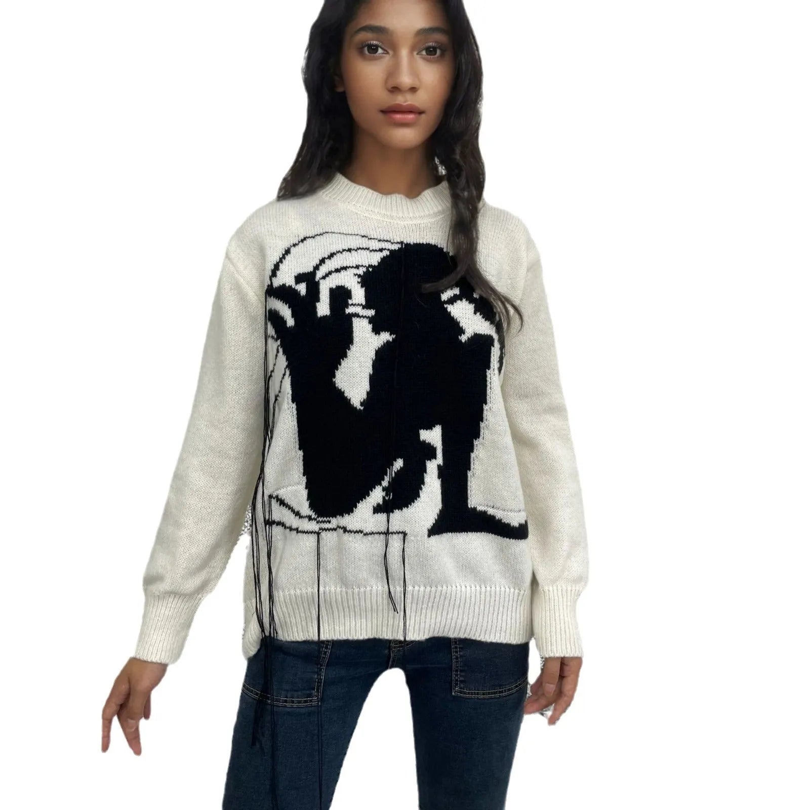 Grey and white women's alpaca wool sweater with tassel detail and abstract pattern.