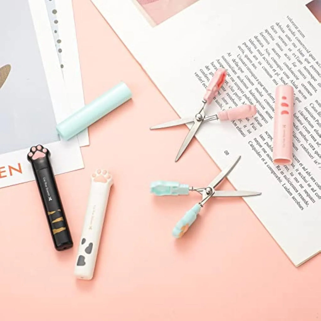 Cat paw mini folding scissors in pink, white, black, and blue colours showing closed and open positions