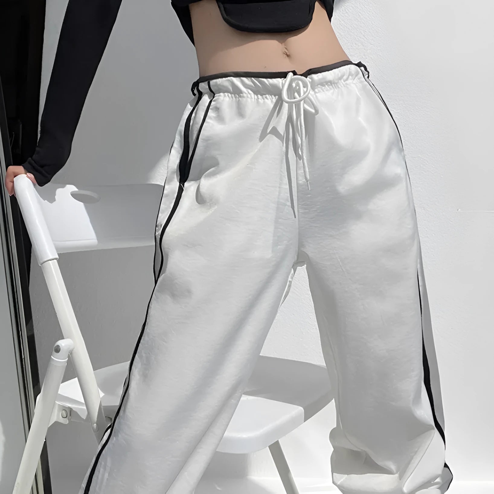 Women's loose straight-leg pants with ribbon parallel bar contrast detailing in navy blue colour option