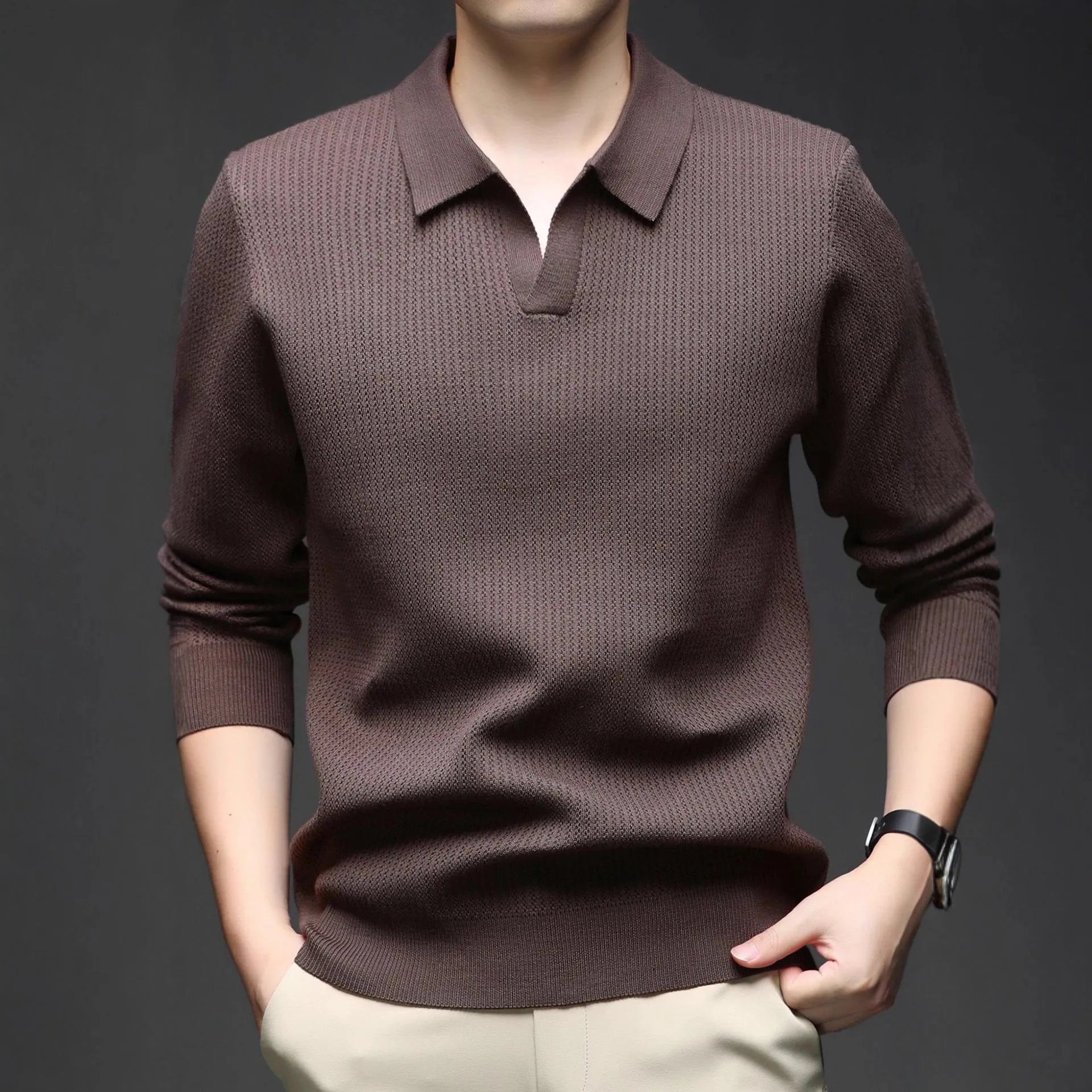 Man wearing a loose green casual pullover sweater, showcasing its autumn leisure style.