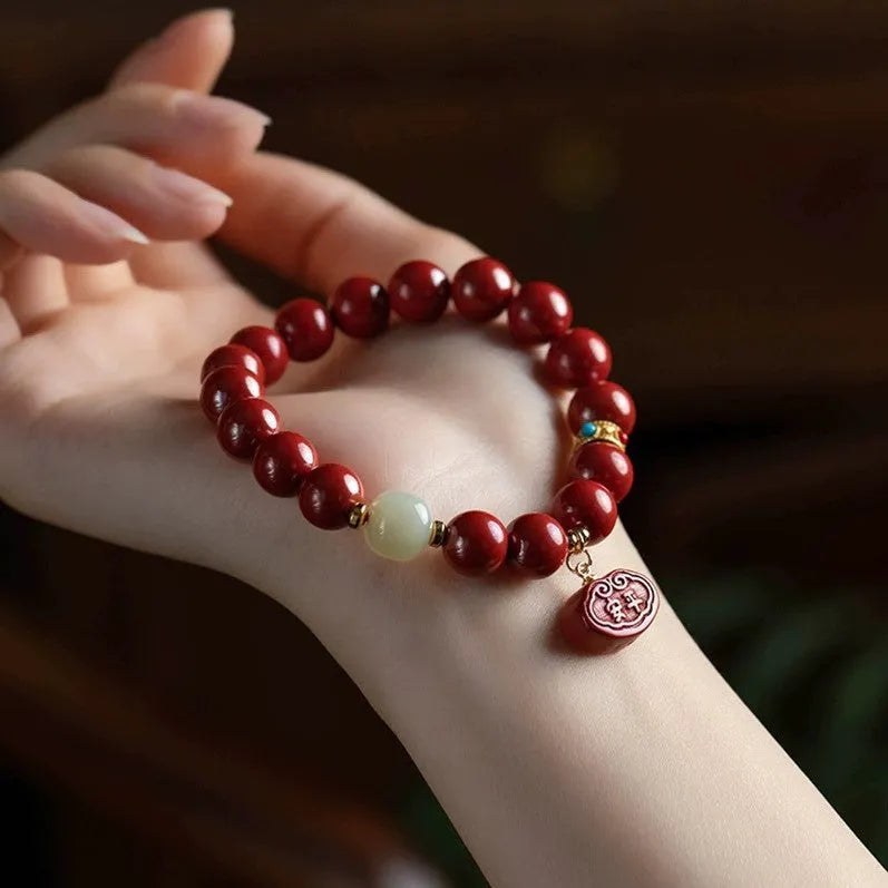 Natural cinnabar bracelet with Emperor sandstone Ping An Fu Lu design in 8mm and 10mm sizes