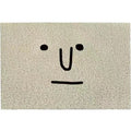 Cartoon Mr Big Nose character design on a square PVC floor mat in geometric colours.