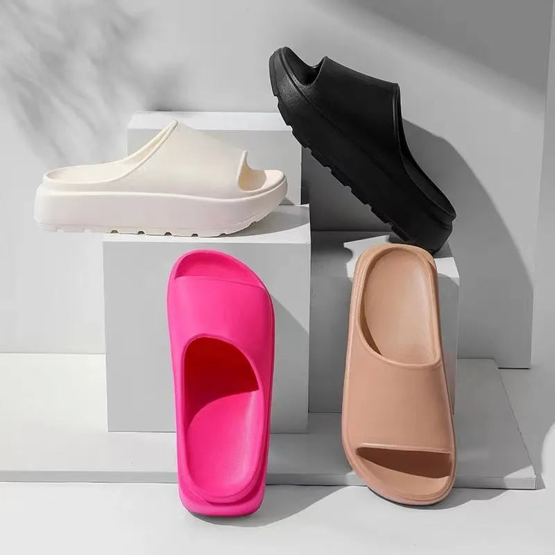 Women's beige thick-soled EVA slippers with a 5.5cm platform, shown from the side.