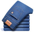 Men's straight loose elastic denim business trousers in dark blue colour, mid-waist straight-leg style on white background