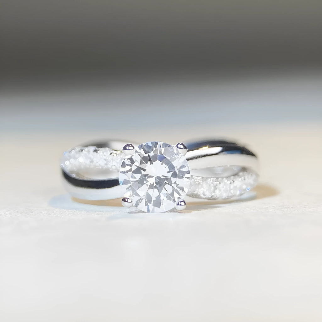 Silver moissanite ring with twisted arm geometric design and 1 carat centre stone