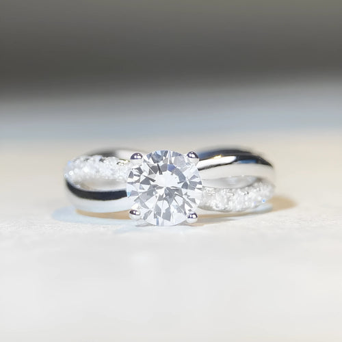 Silver moissanite ring with twisted arm geometric design and 1 carat centre stone