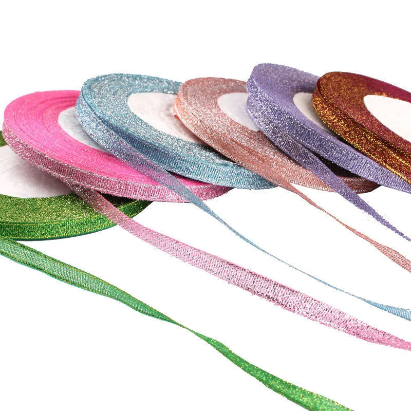 Roll of narrow 0.6cm wide polyester gift wrapping ribbon in an assorted colour, showing 22 metre length.