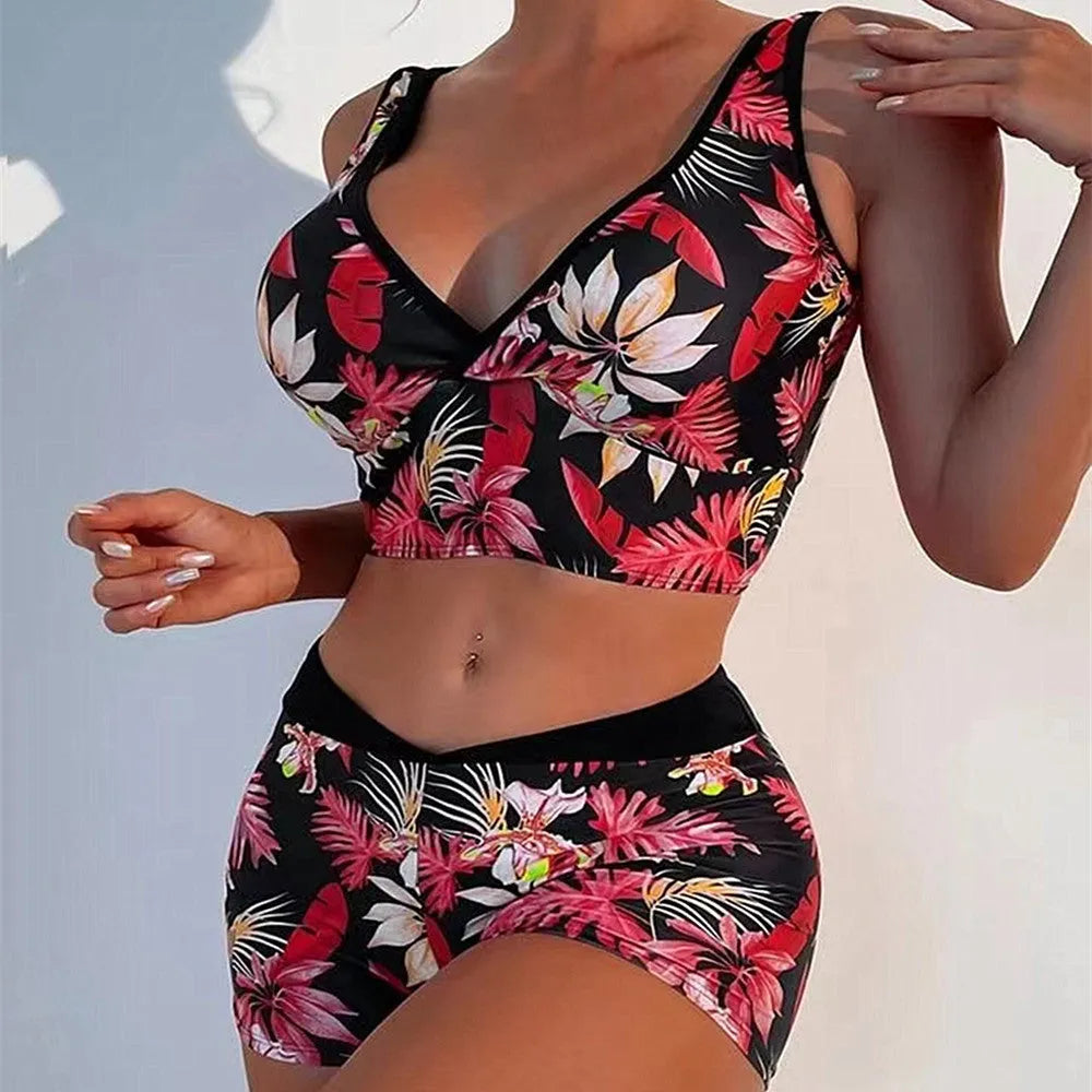 Women's two-piece swimsuit with sleeveless top and printed boxer briefs in multi-colour pattern