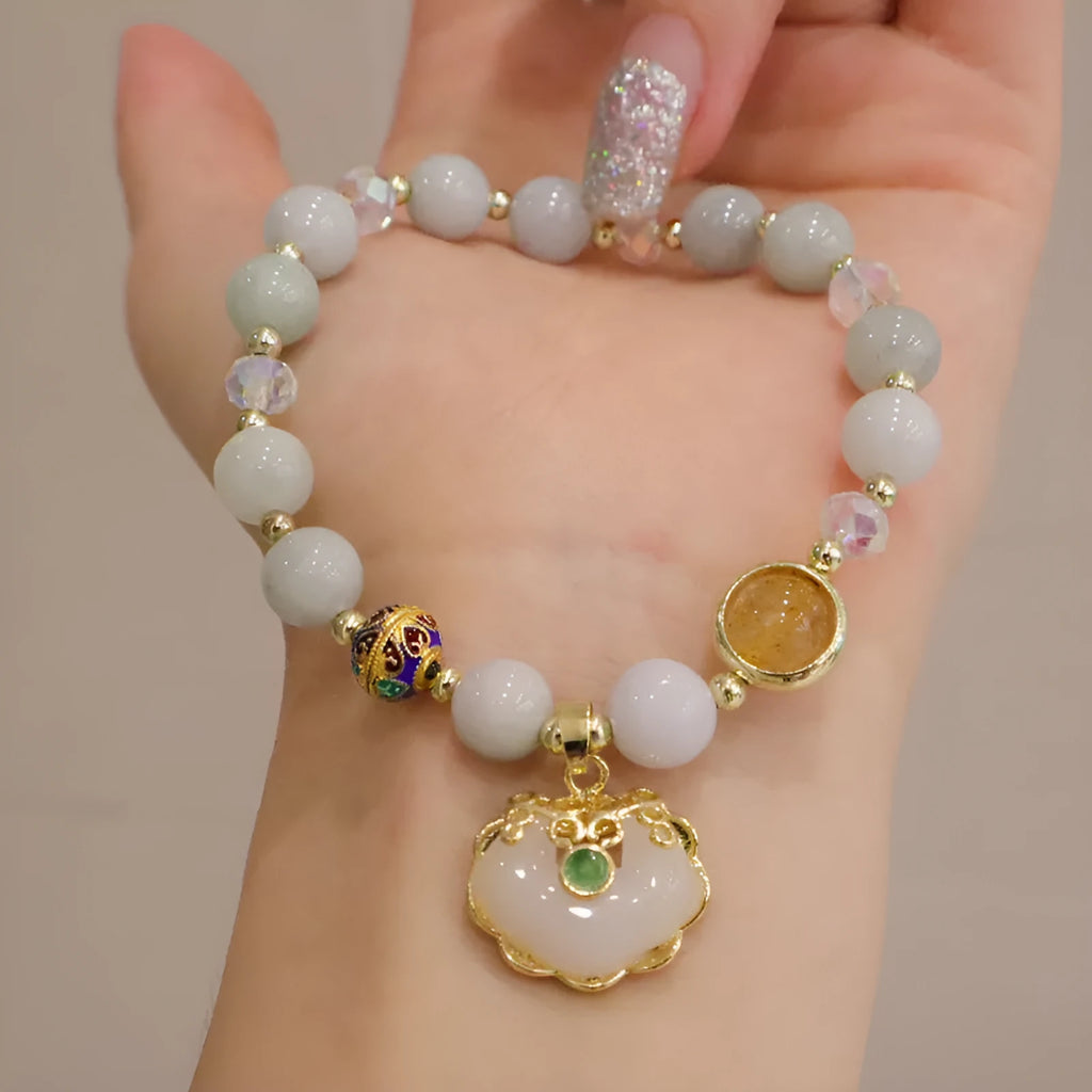 Geometric women's bracelet with ethnic metal decoration, available in Gray Jade or Strawberry Quartz.