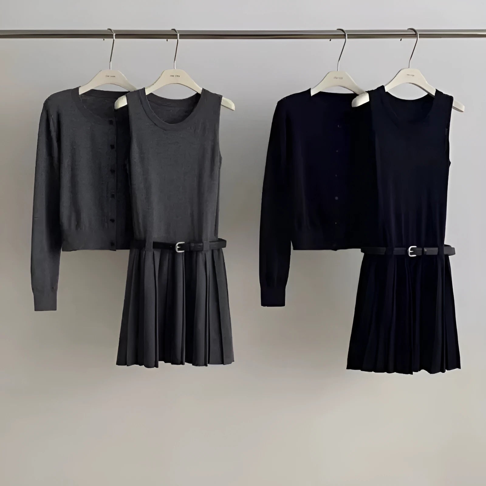 Grey women's art retro knit two-piece set featuring a pleated vest skirt with belt and a long-sleeved cardigan.