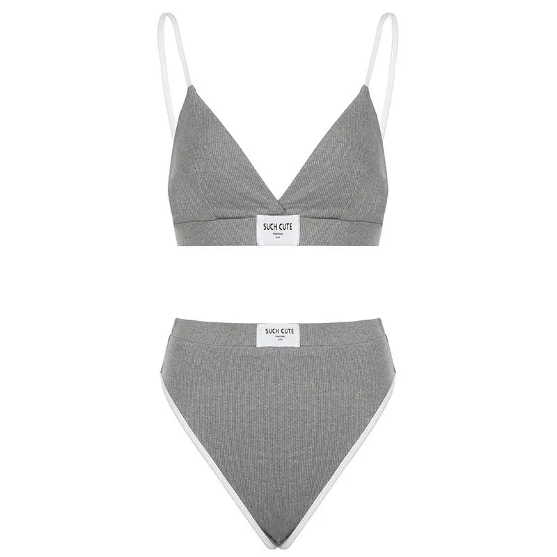 Women's grey bikini set with embroidery detailing and contrast binding on sleeveless top and shorts-length pants