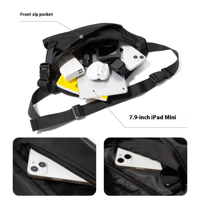 Black slanted chest bag with sewing line details, worn crossbody style