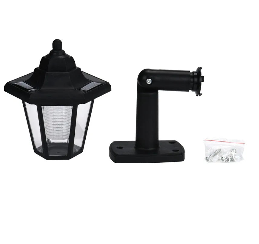 Black hexagonal solar wall lamp for outdoor garden lighting with automatic light sensor