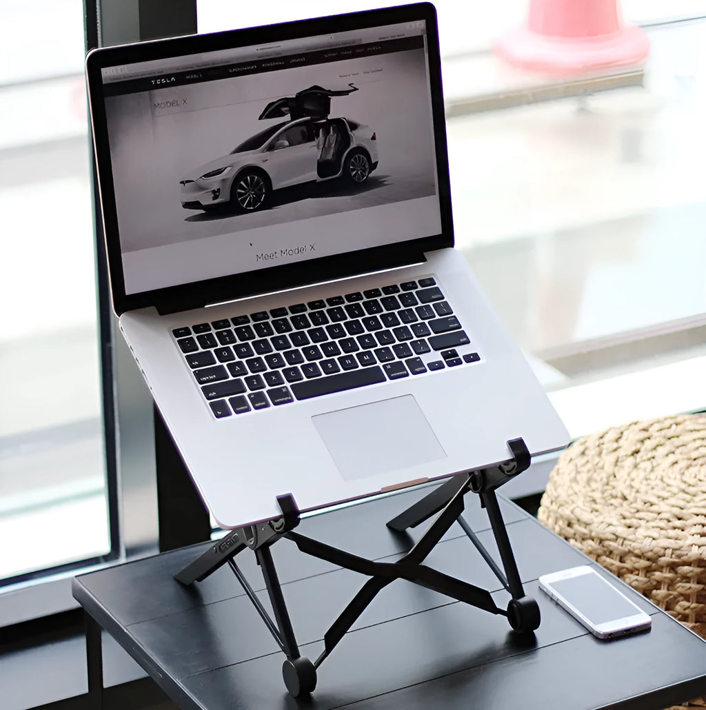 Black folding portable laptop stand made of reinforced nylon, shown in open and closed positions.