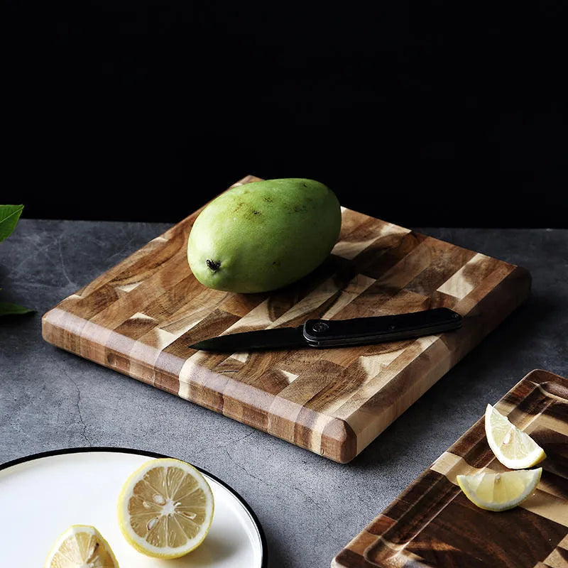 Brown acacia solid wood chopping board with parquet design, 3cm thick, on a kitchen counter
