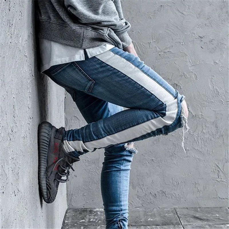 Men's ripped cotton denim jeans in black with distressed detailing, front view