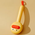 Small yellow duck-shaped pet grooming comb with open sections and needle teeth