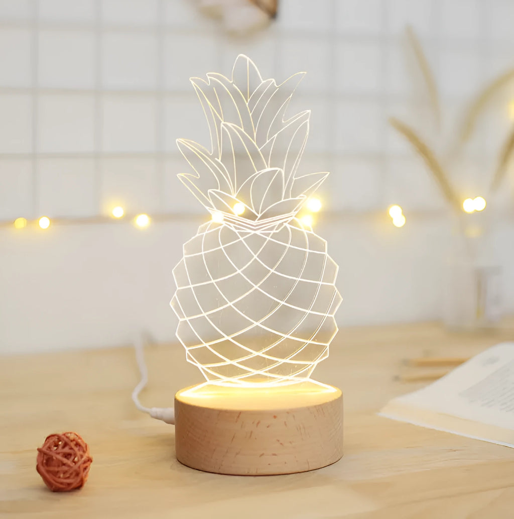 Cartoon pineapple shaped table lamp with wooden base and acrylic shade on a bedside table.