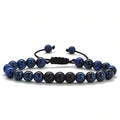 Matte black agate couple bracelets with geometric beads on wrist.