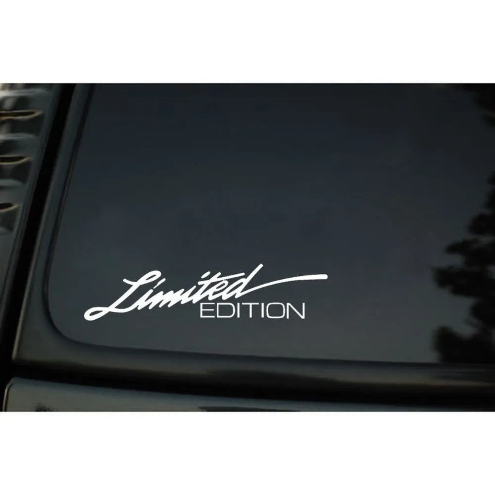 British reflective plastic bumper sticker shown in black, white and colourful variants, dimensions 16cm by 3.8cm.