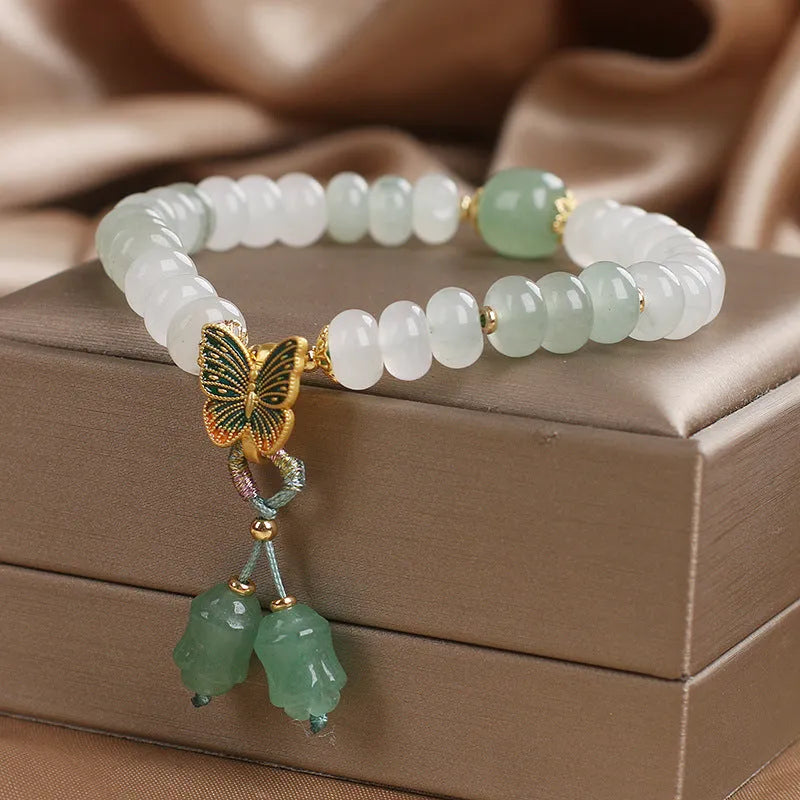 Green women's bracelet with Tian Shan Cui abacus beads and retro butterfly tassel design