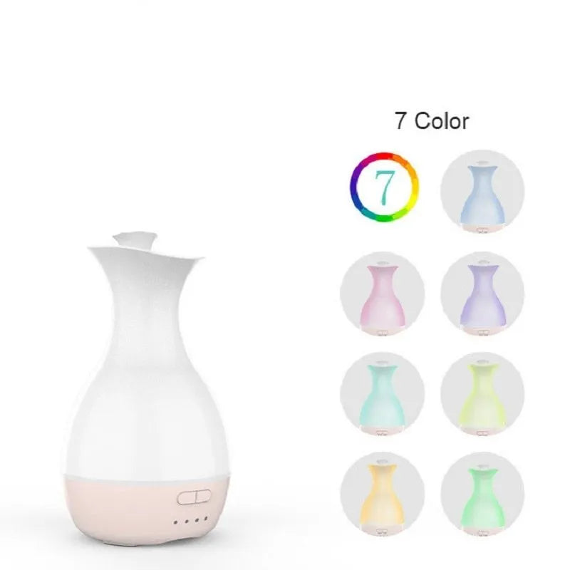 White ultrasonic aromatherapy humidifier with 200ml tank and colourful night light on wooden surface