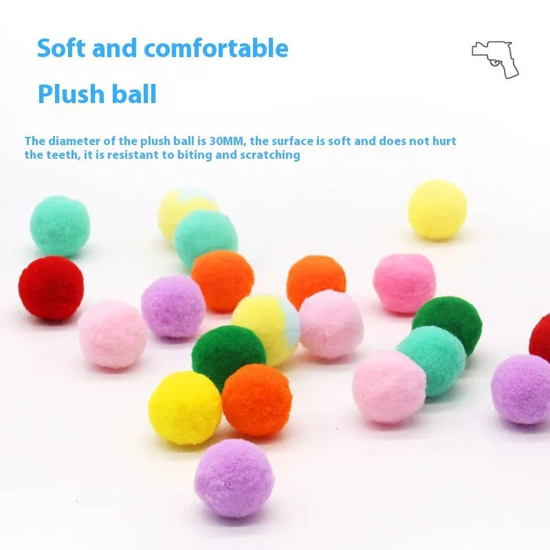 Plush ball launching gun for dogs next to a pile of soft coloured yarn balls.