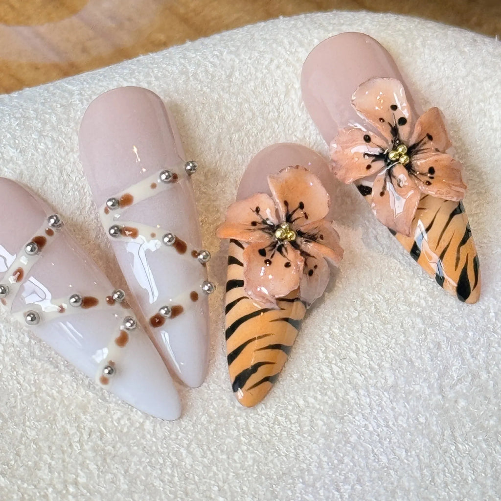 Ten artificial nail stickers with leopard print, cross, and floral patterns in French style design