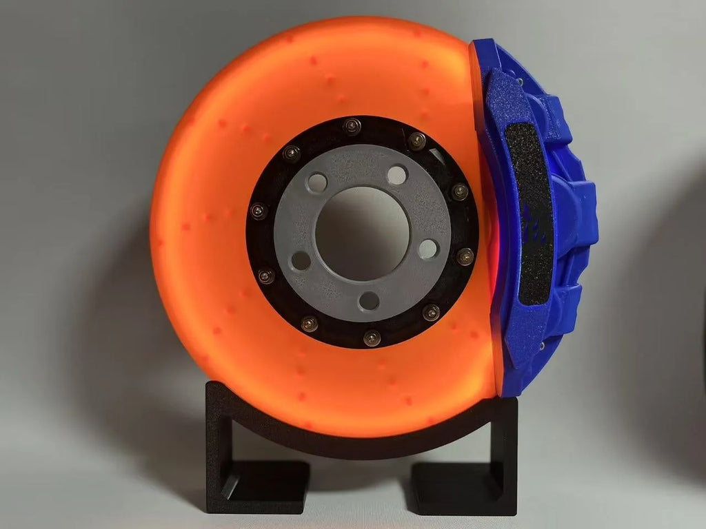 Blue brake disc LED night light with bracket on desk, showing 24cm disc and touch switch